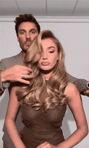 gif of Chris Appleton styling  models hair using hairspray