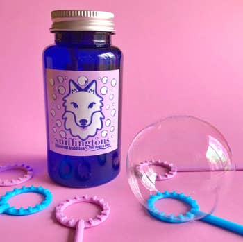 Blue bubble solution bottle with wand rings