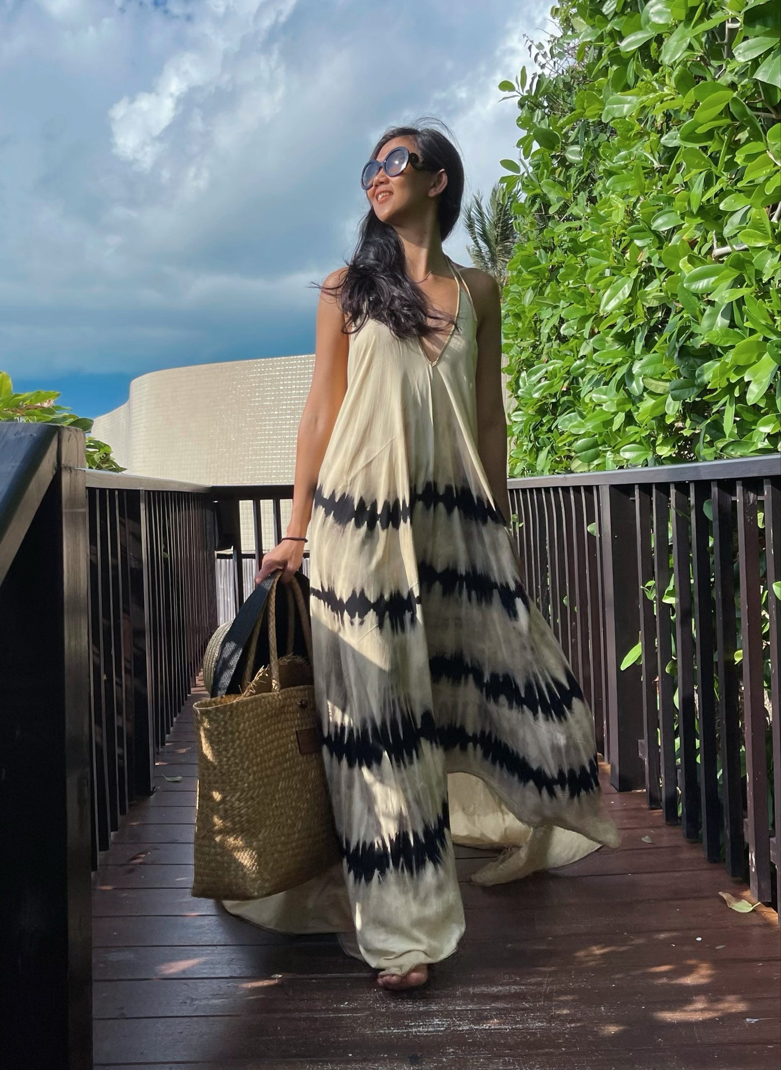 model in black-and-white tie-dye maxi dress