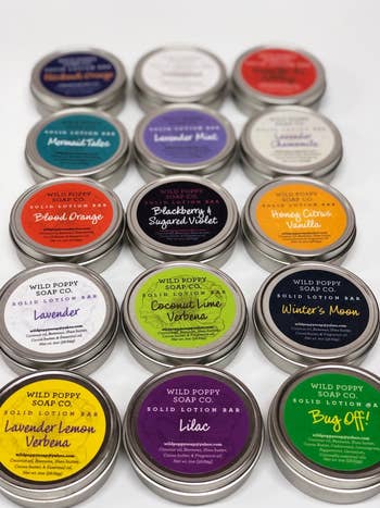 tins of solid lotion in different scents