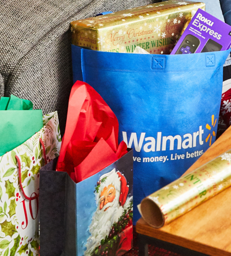 Walmart shopping bags, gift bags, wrapping paper, snow globe, and mini bows