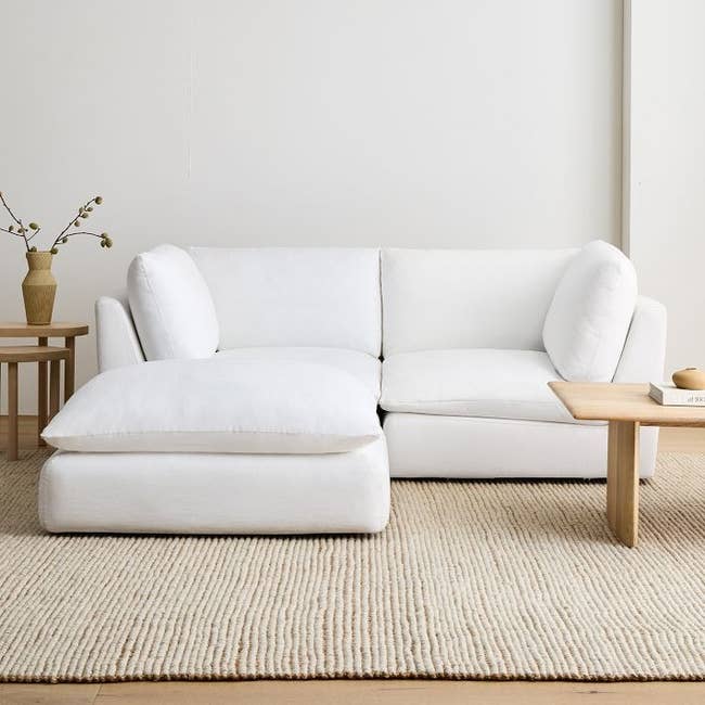 a white three-piece modular sectional sofa