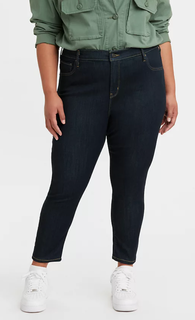 a model wearing the jeans in dark blue