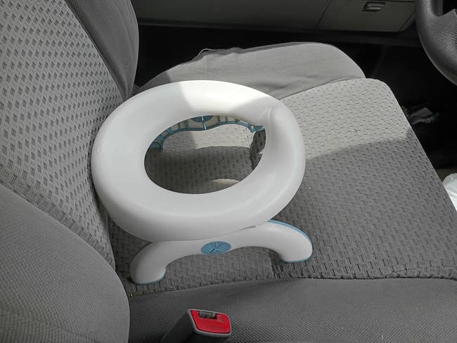 Portable toddler potty spot   connected  a car   seat, perfect  for question   convenience and casual  potty grooming  connected  the go