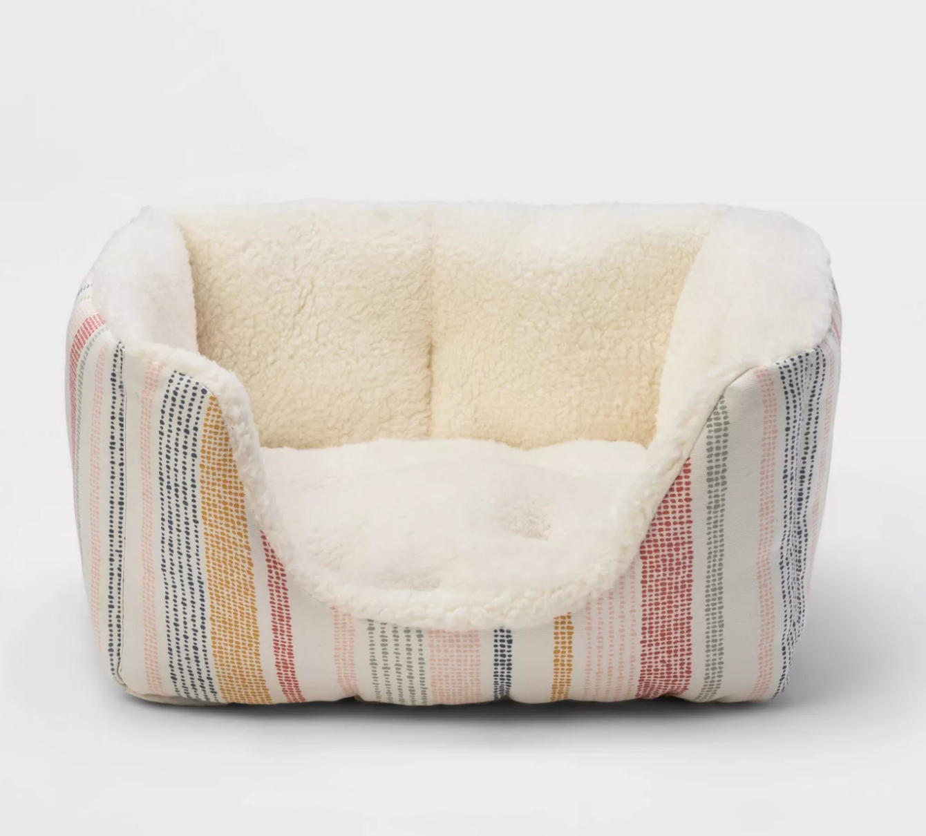 a high walled pet bed with a plush inside and striped design on the outside