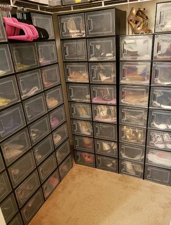 reviewer's stacked, clear shoe storage boxes filled with shoes