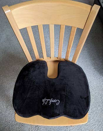 reviewer photo of the black seat cushion on a wooden chair