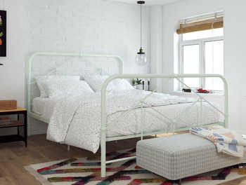 lifestyle photo of mint green farmhouse bed frame in bedroom