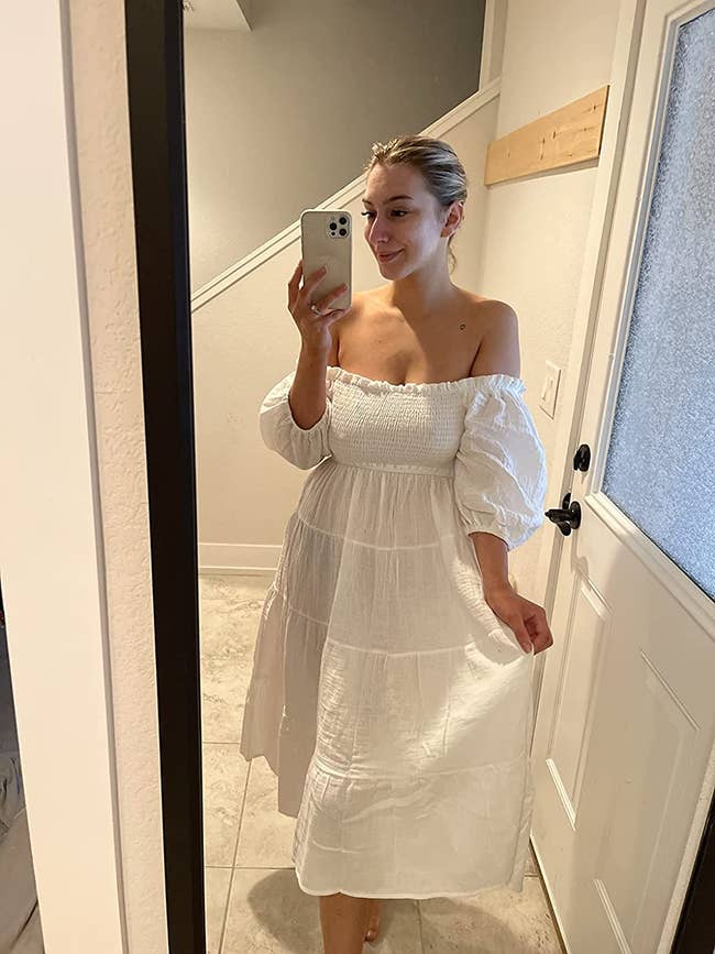 reviewer mirror selfie wearing off the shoulder white dress