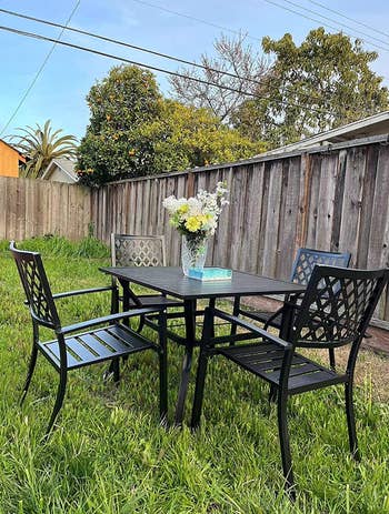 the dining set in a yard on the grass