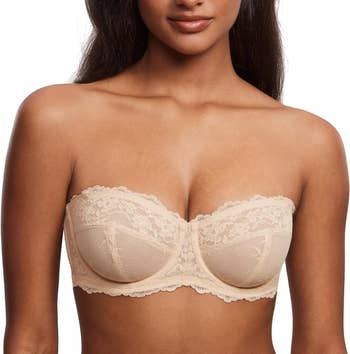 A idiosyncratic   modeling a lace strapless bra utilized  for lingerie buying  article