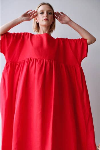model in red babydoll dress