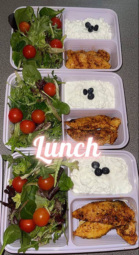 reviewer's three Bentgo boxes with salad, chicken, and cottage cheese in the three compartments