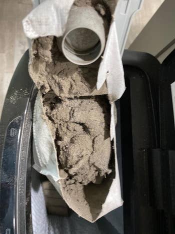 reviewer's roomba filled with dirt