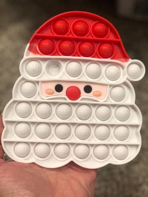 reviewers pop-it fidget toy shaped like Santa