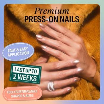 A person's hands with manicured nails, highlighting press-on nails' features: fast application, customizable, and lasting up to two weeks