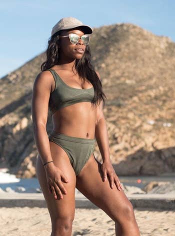 reviewer wearing the bathing suit in army green