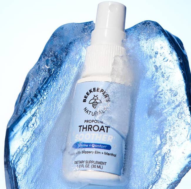 throat soother spray against a splash of water