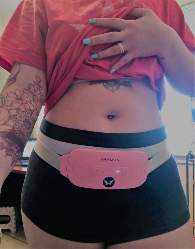 Image of reviewer wearing pink heating pad