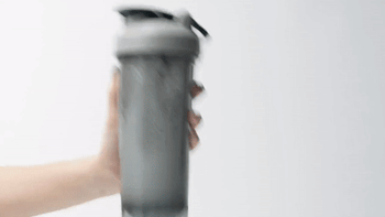 gif of someone shaking different bottles with the bottle cleaner inside