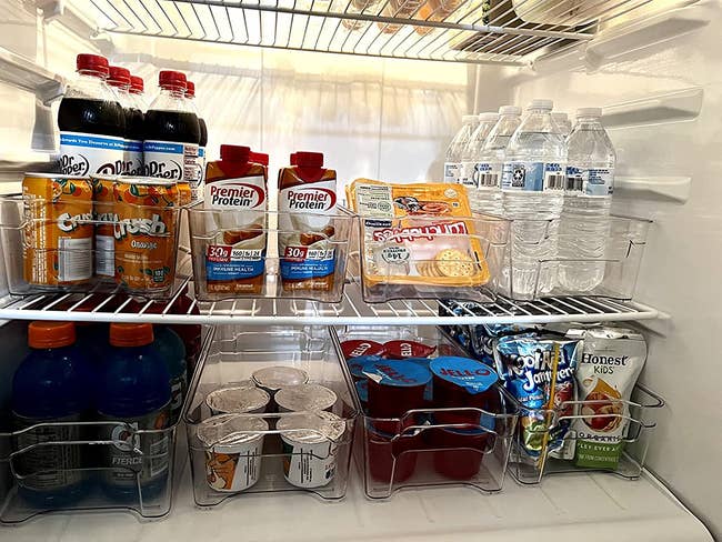 inside of reviewer's fridge with food and drinks organized in clear bins