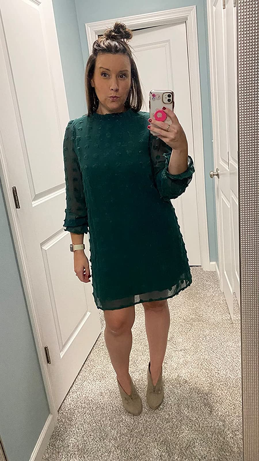 Reviewer is wearing the dotted chiffon dress in an emerald green color