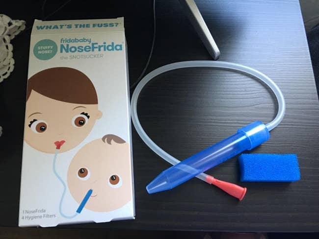 The Nose Frida tool and filter next to the packaging