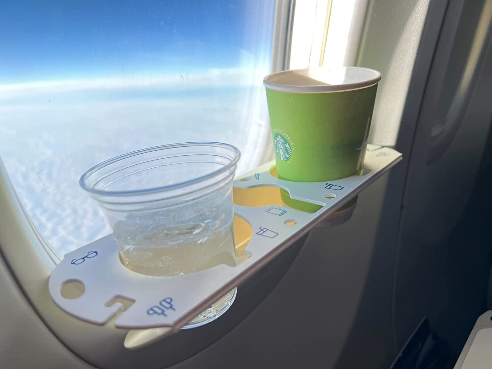 reviewer photograph  of the bevledge holding 2  cups portion    attached to a level   window