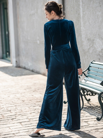 back of model wearing the blue velvet jumpsuit