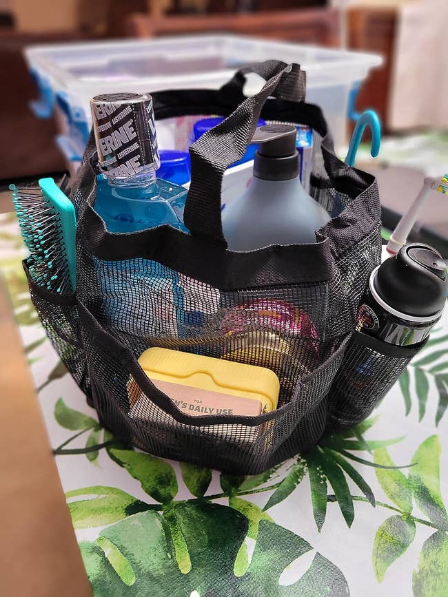 The mesh ablution caddy holding assorted items