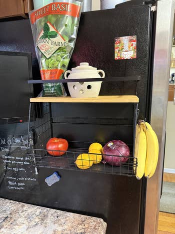 reviewer representation  of support  connected  fridge holding a fewer  veggies, room  essentials, and with bananas hanging connected  broadside  hook. 