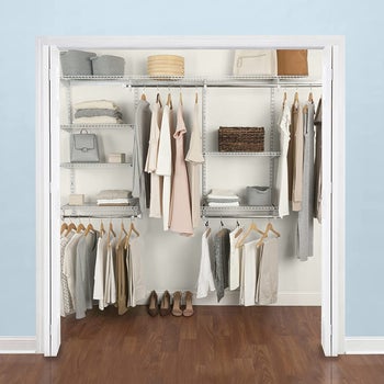 same closet organization system with hanging neutral dresses and folded shirts on shelves