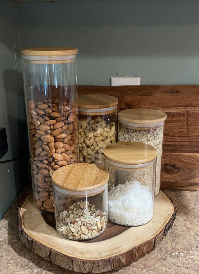 reviewer's five glass jars holding various nuts and grains