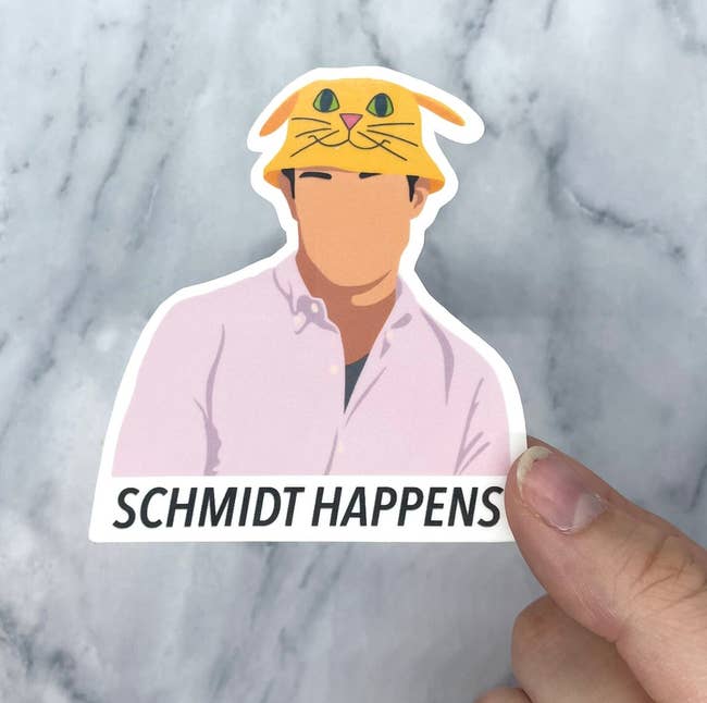 sticker of schmidt in cat bucket hat from second episode of new girl and text 