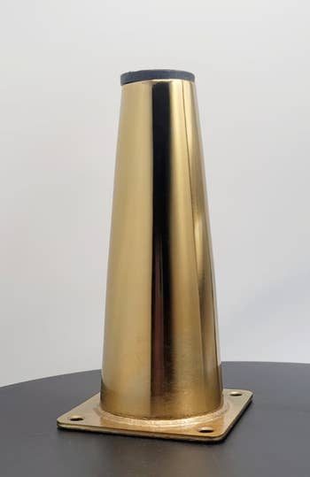 a brass metal leg