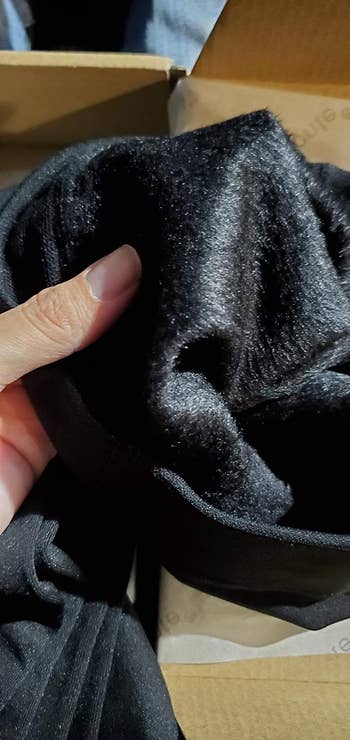 reviewer showing the fleece lining the inside of the black tights
