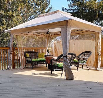 reviewer's white pop up gazebo on a deck