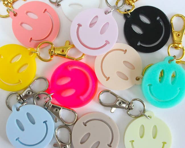 various smiley face keychains in different colors