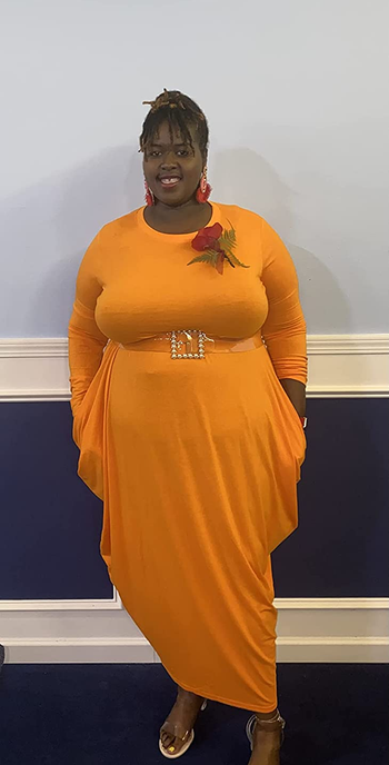 a reviewer wearing the dress in a long sleeve option