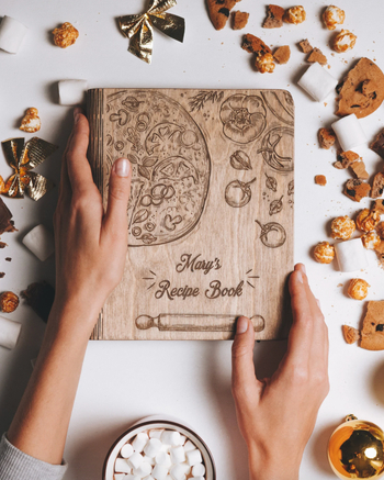 Image of someone holding the brown cookbook