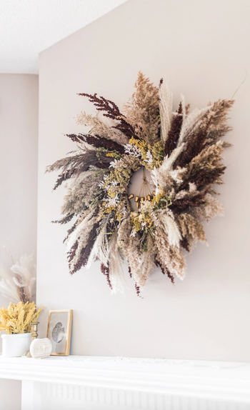 the same wreath hung inside over a mantle