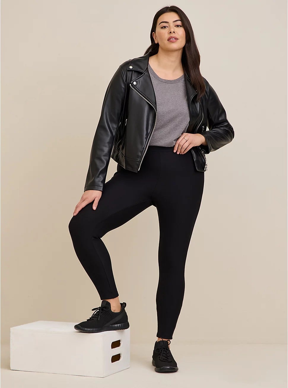model posing wearing black fleece-lined leggings
