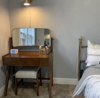 reviewer photo of the vanity in the corner of bedroom