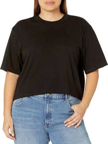 Person in a black crop top tee-shirt 