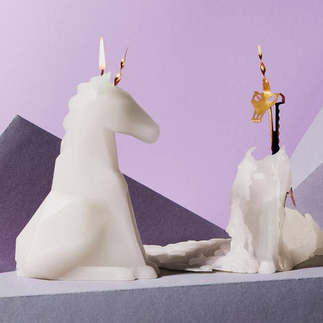 a white unicorn candle that melts to reveal a skeleton