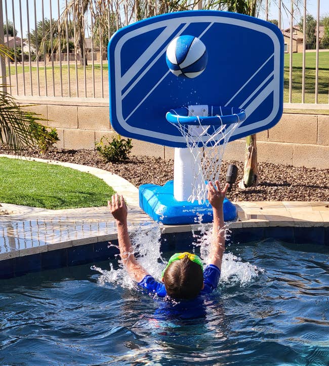 reviewer photo of someone throwing ball into pool basket ball hoop