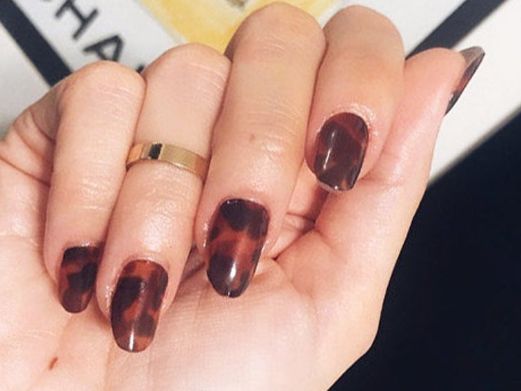 a model wearing the nail wraps 