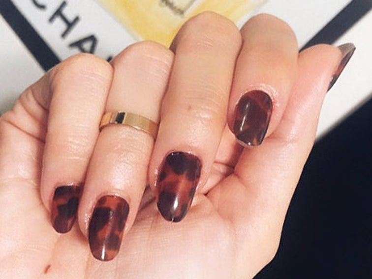 a model wearing the nail wraps