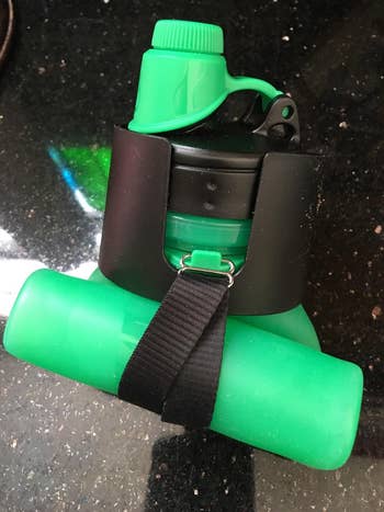 reviewer's green water bottle, rolled up