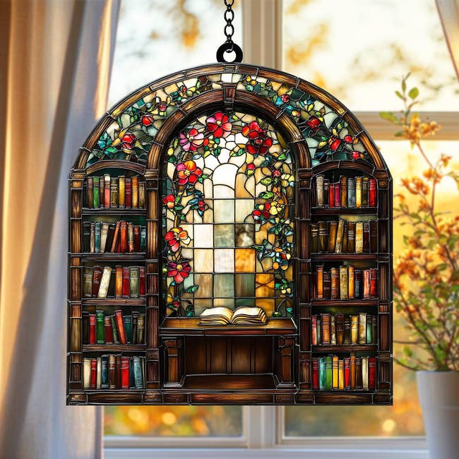 Stained solid model sheet depicting a bookshelf with books and flowers, hanging successful beforehand of a model with a brushed outdoor view